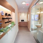 A bright, narrow hallway leading toward the reception area