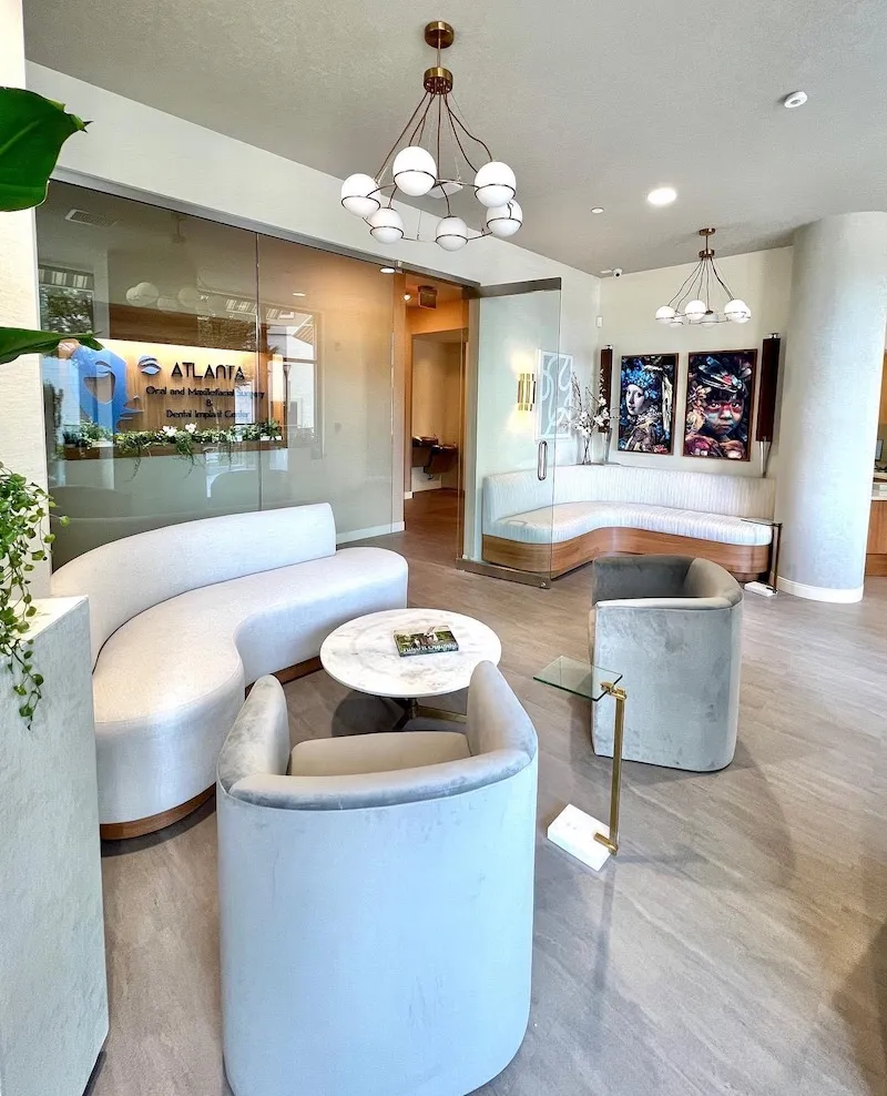 Another perspective of the clean, modern waiting room with multiple seating arrangements