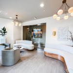 Wide-angle view of the reception lounge with modern furniture and a bright, open feel