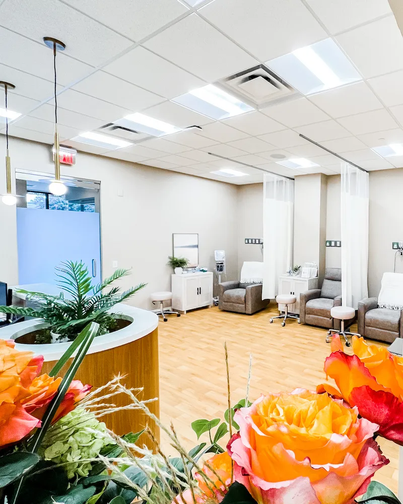 A spacious, well-lit treatment area with a patient chair and medical equipment