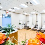 A spacious, well-lit treatment area with a patient chair and medical equipment