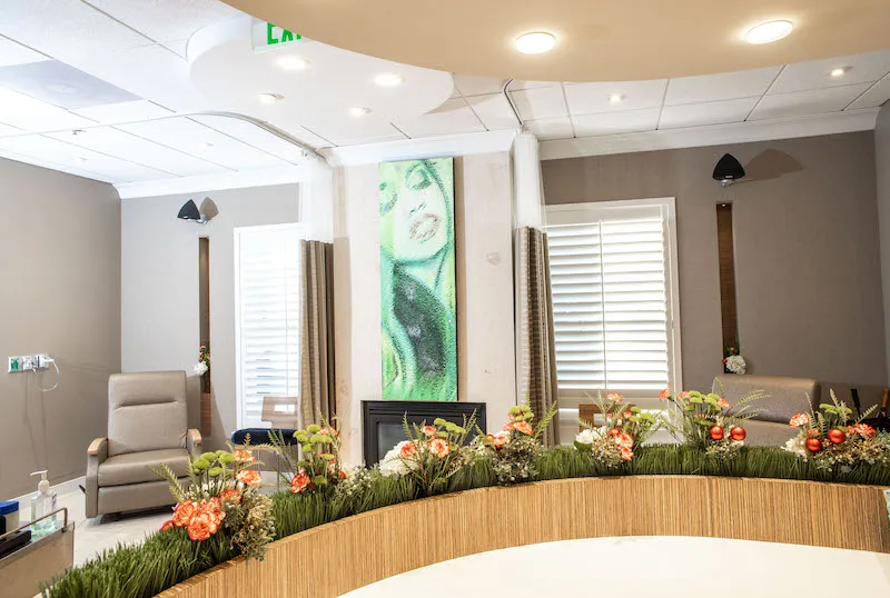 : A bright, open clinical space with multiple recovery bays separated by modern partitions